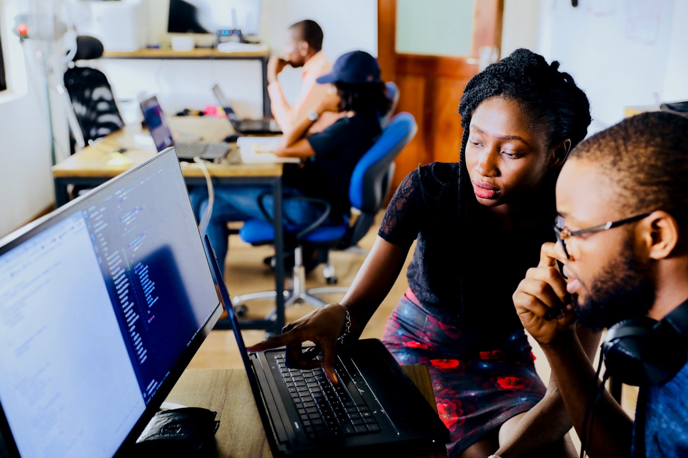 Team working on laptops in an office