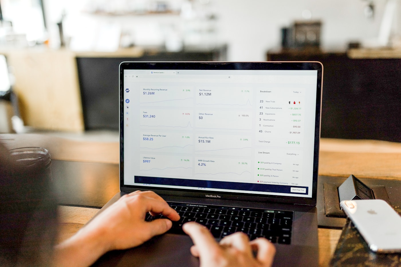 Person reviewing reports on screen